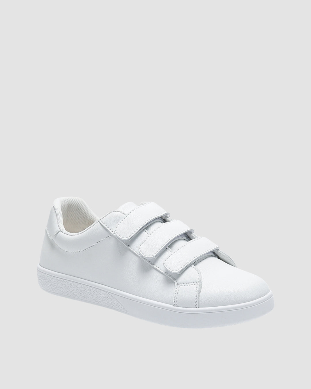 White sneakers with three velcro straps.